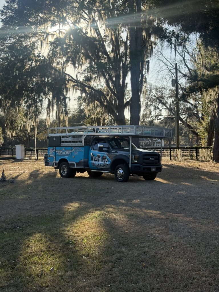 Miller & Sons truck for a farm plumbing job