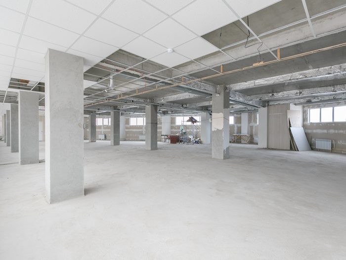 empty pure commercial office building undecorated in gray colors.open space office
